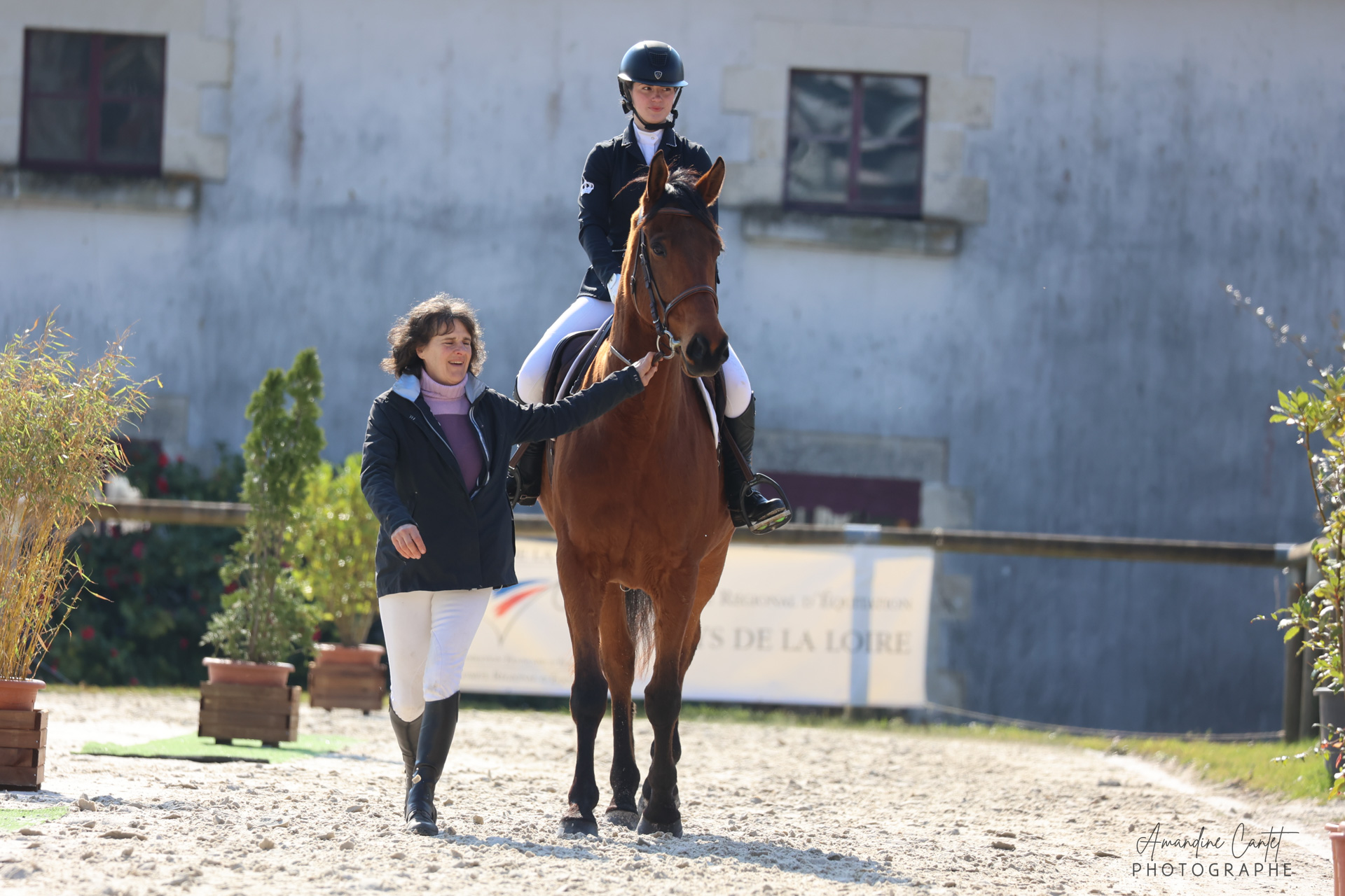 Cavalière accompagnée par sa coach